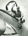 John Glenn sitting outside the cockpit of his F8U-1P Crusader during the "Project Bullet" record breaking transcontinental flight, 1957
