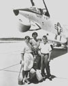 John Glenn poses with his family in front of the F8U Crusader he flew in Project Bullet, his record breaking transcontinental flight, 1957